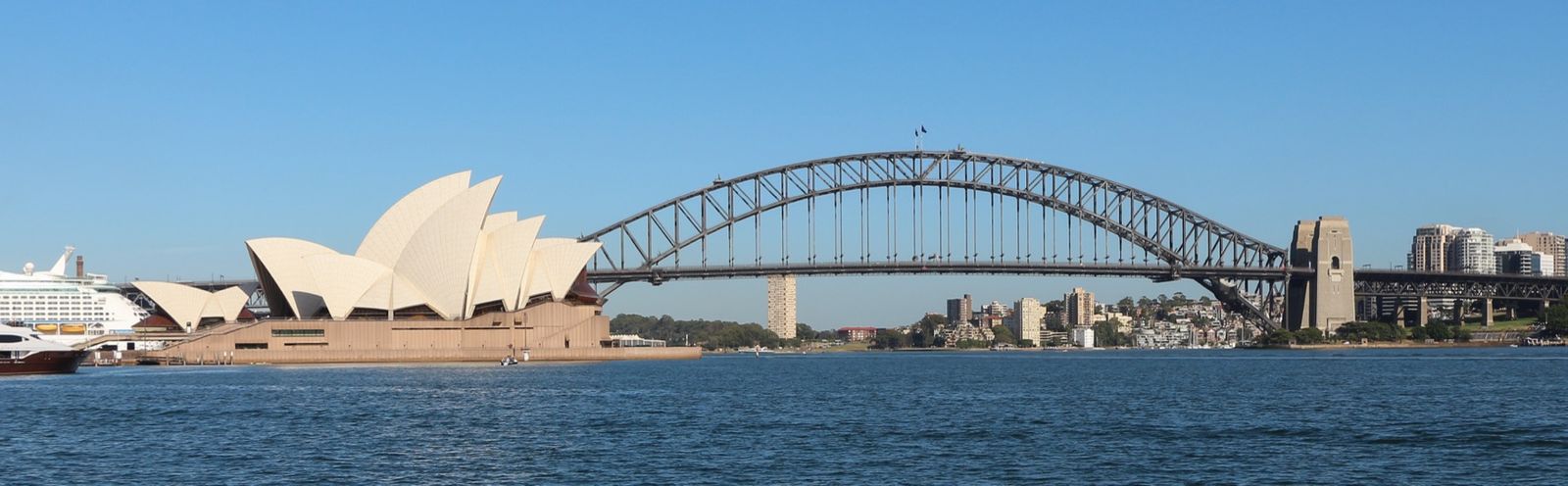 The Opera House and Harbour Bridge across the water from Mrs Macquaries Point